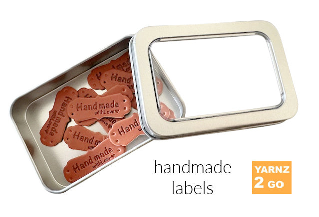 Handmade labels in a tin